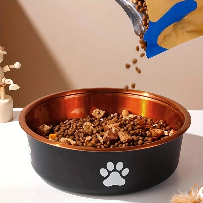 A pet food bowl filled with kibble and chunks , as food is being poured from a bag above. White paw prints decorate the bowl.