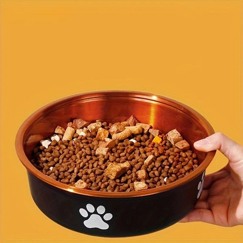 A pet food bowl filled with kibble and treats, featuring a paw print design.