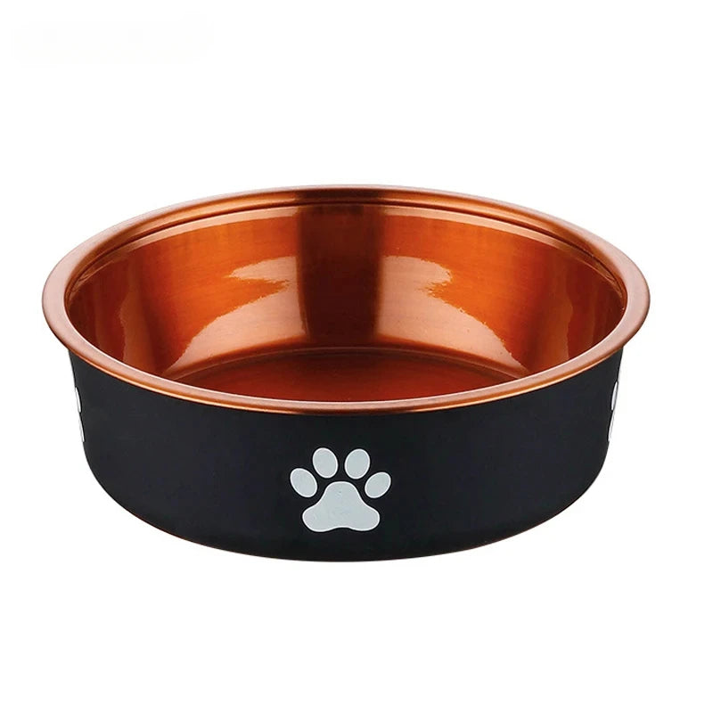 A sleek pet bowl with a black exterior and shiny copper interior, featuring white paw print designs on the side.