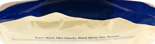Close-up of a pet food bag featuring a blue and cream design with the slogan, "Love them like family. Feed them like family."