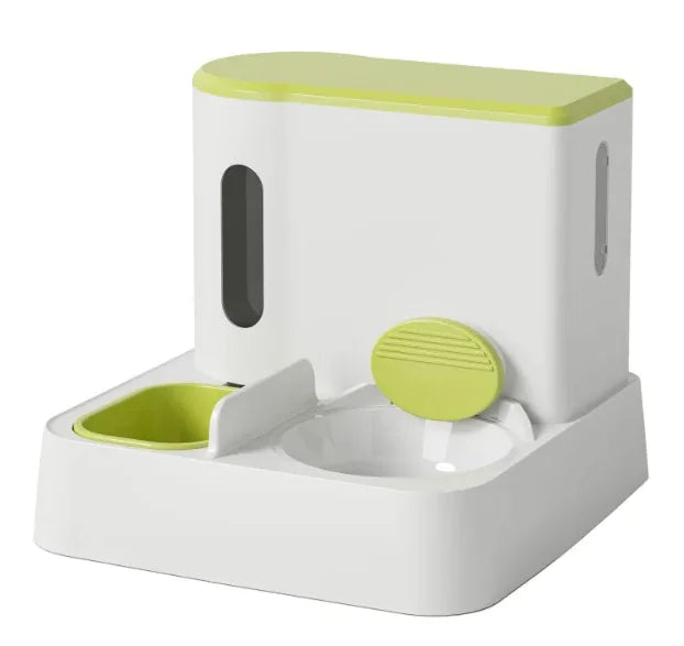 A modern pet feeding station featuring a white base with a lime green top, including two bowls and a clear food storage compartment.