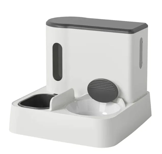 A modern pet feeder with a sleek design, featuring a stainless steel bowl and a compartment for food storage.