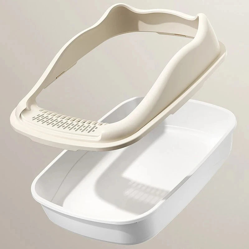 A beige cat litter box lid rests above a white litter tray, designed for pet hygiene and convenience.