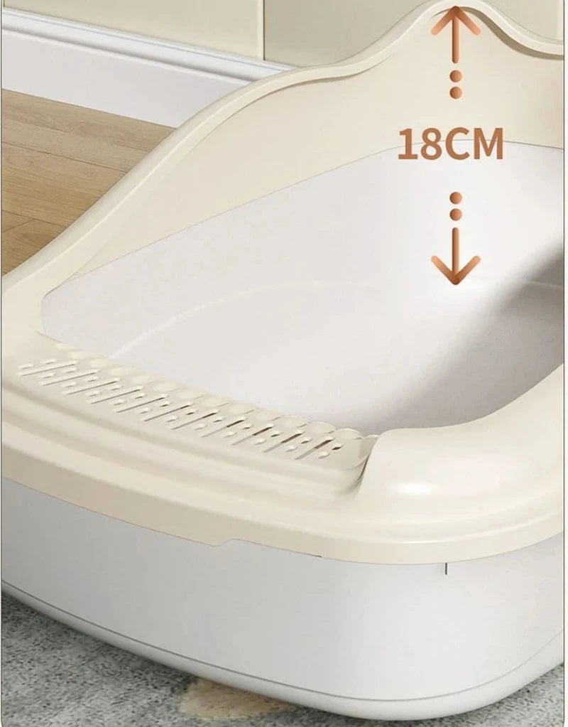 Close-up of a beige pet litter box with a height of 18 cm, showcasing its smooth interior and slotted front for easy access.