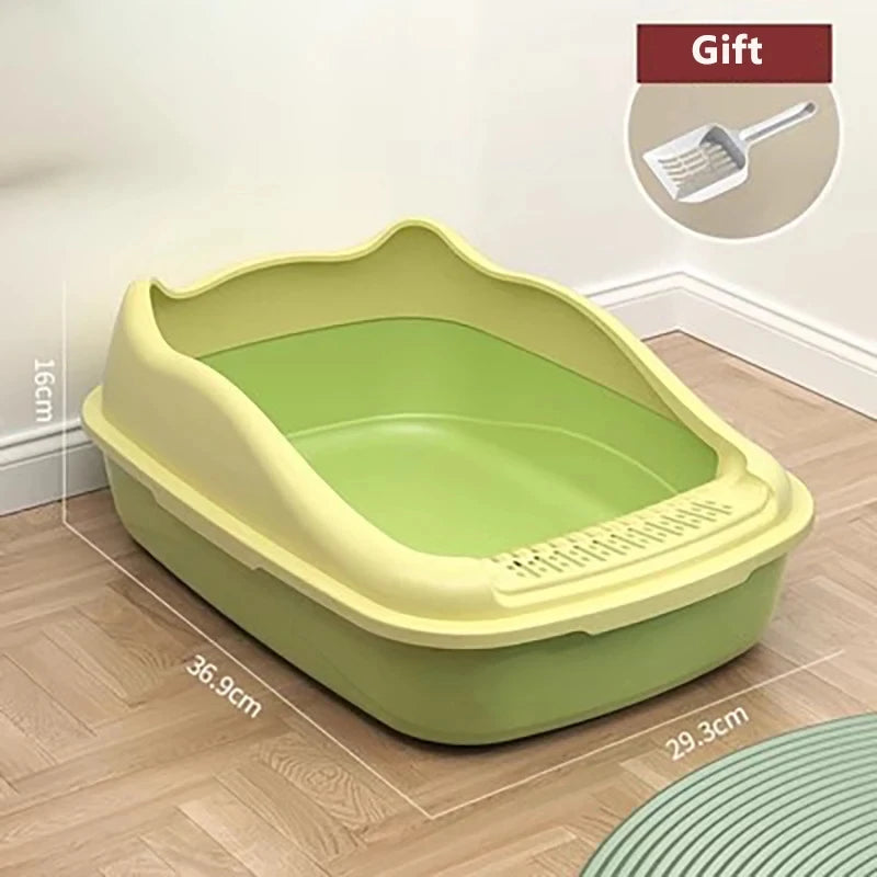 A green and yellow cat litter box with dimensions displayed; includes a gift of a small scooper in the corner.