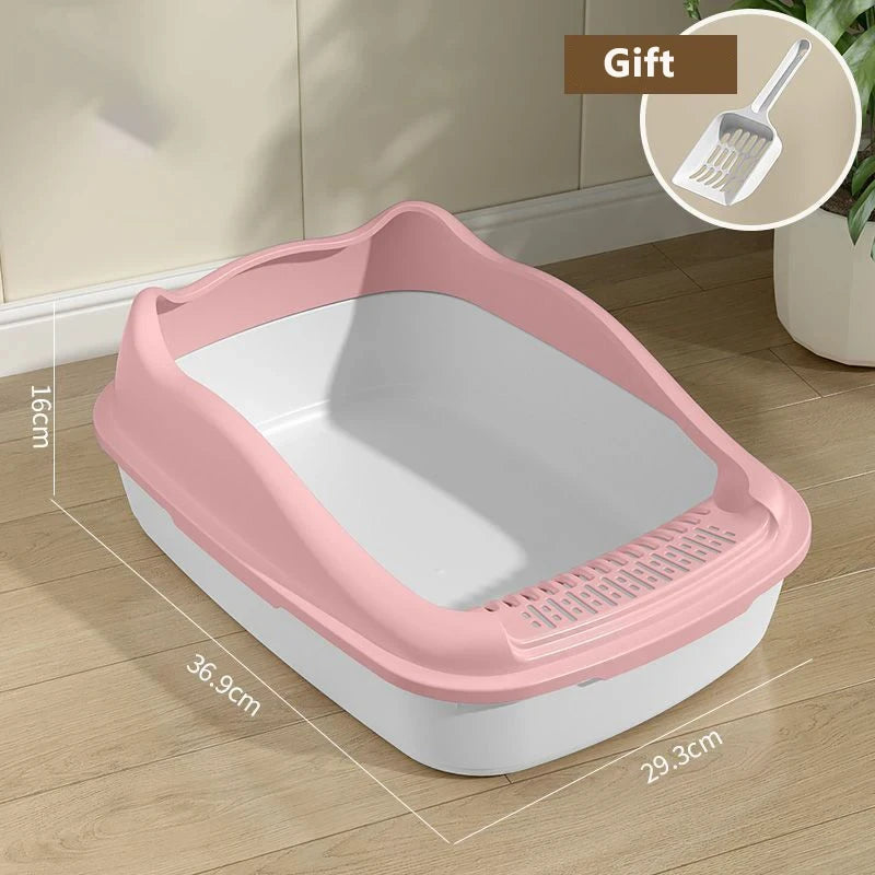 Pink and white cat litter box with dimensions displayed, featuring a scoop as a free gift, set on a wooden floor.