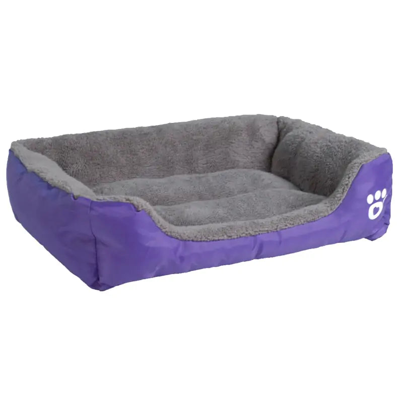 Cozy purple dog bed with a soft gray fleece interior and raised sides for comfort, featuring a paw print design.