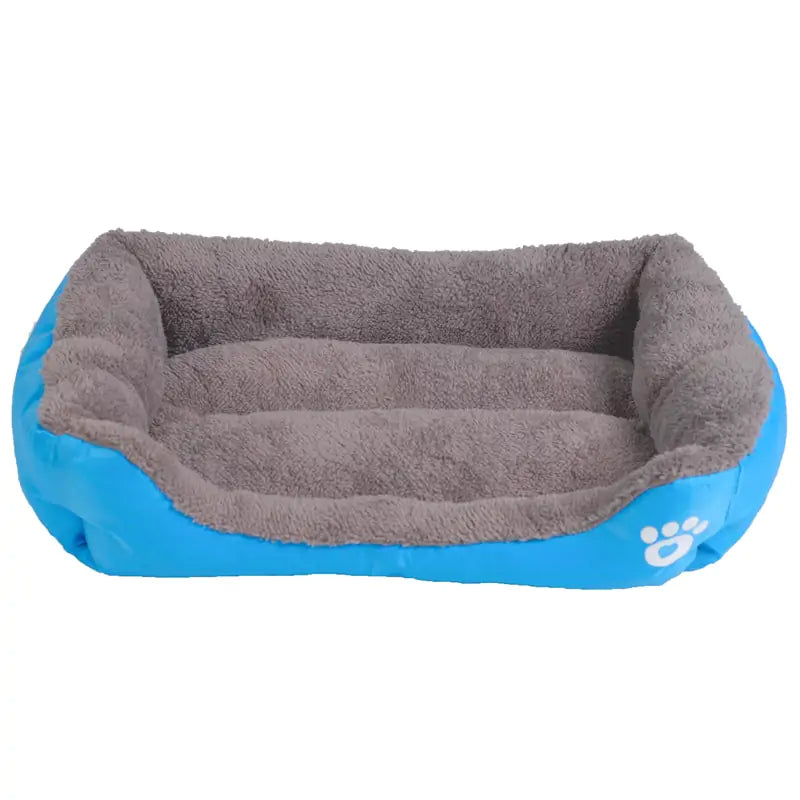 A cozy dog bed featuring a soft gray interior and a vibrant blue exterior, designed for pet comfort and relaxation.