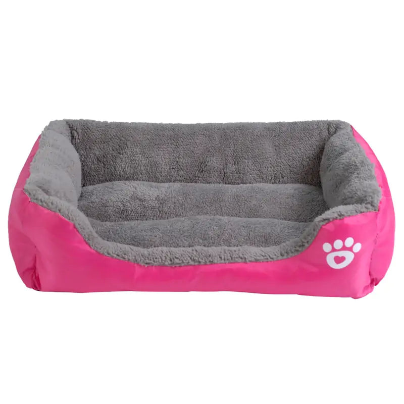 Cozy pet bed featuring a soft gray interior and vibrant pink exterior with a cute paw print design. Ideal for small dogs or cats.