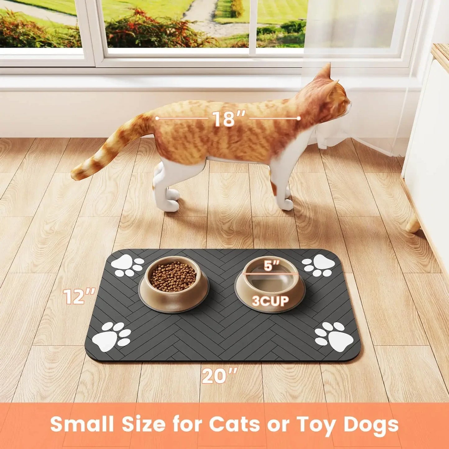 A cat stands beside a black feeding mat featuring two bowls, measuring 20"x12", ideal for small pets.