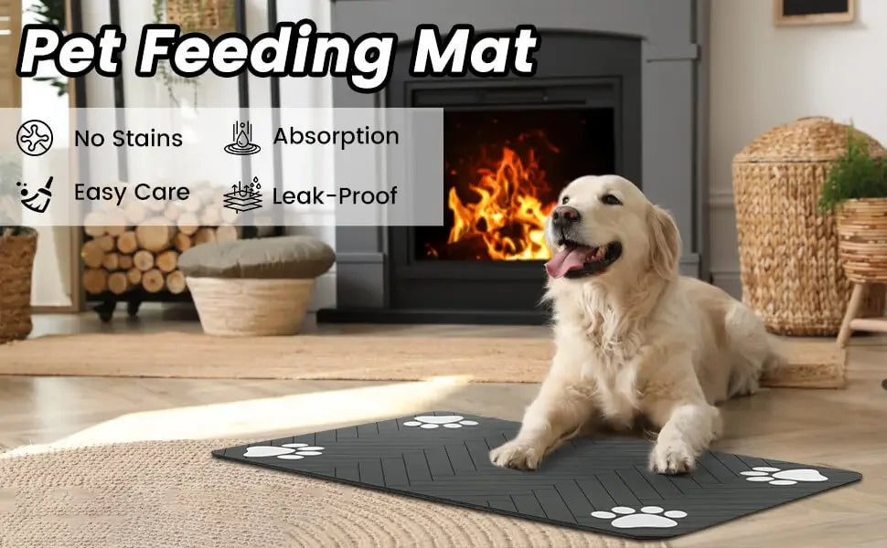 A dog sits on a black pet feeding mat with paw prints. Features include stain resistance, absorption, and easy care.