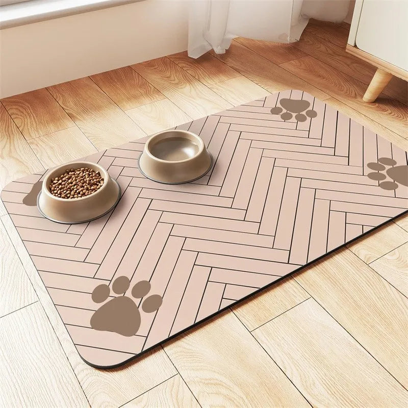 A pet feeding mat with two beige food bowls on a herringbone-patterned surface, accented by paw print designs.
