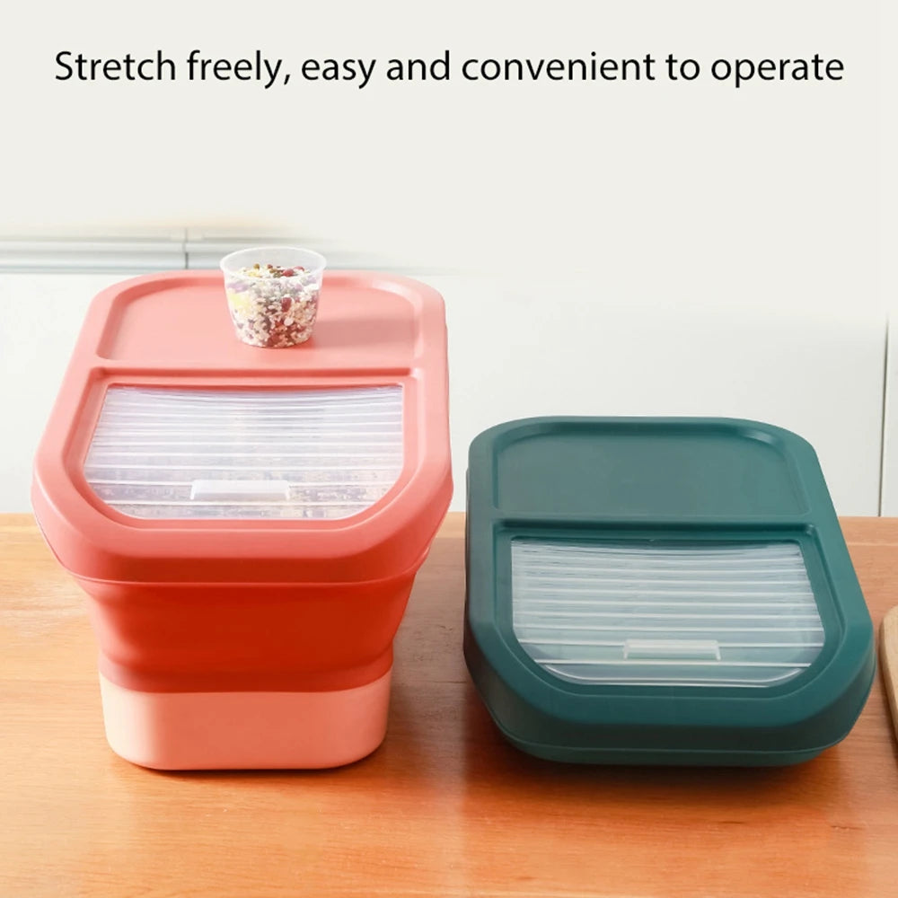Two stylish food storage containers in pink and green, featuring clear lids and a small cup of colorful ingredients on top, set on a wooden surface.
