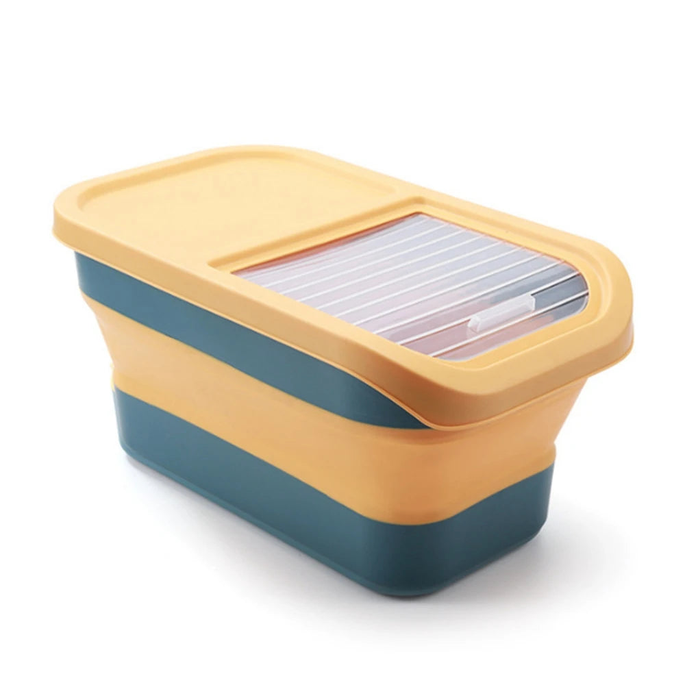 Collapsible storage container in yellow and teal, featuring a transparent lid with slats for easy viewing of contents.