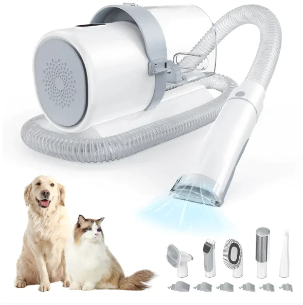 A pet grooming vacuum with a hose and various attachments, alongside a dog and cat, showcasing its use for pet hair removal.