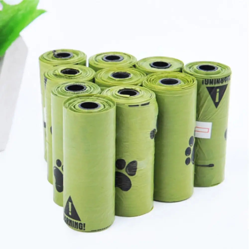 green pet waste bag rolls with black paw print designs on the sides, arranged side by side on a white background.