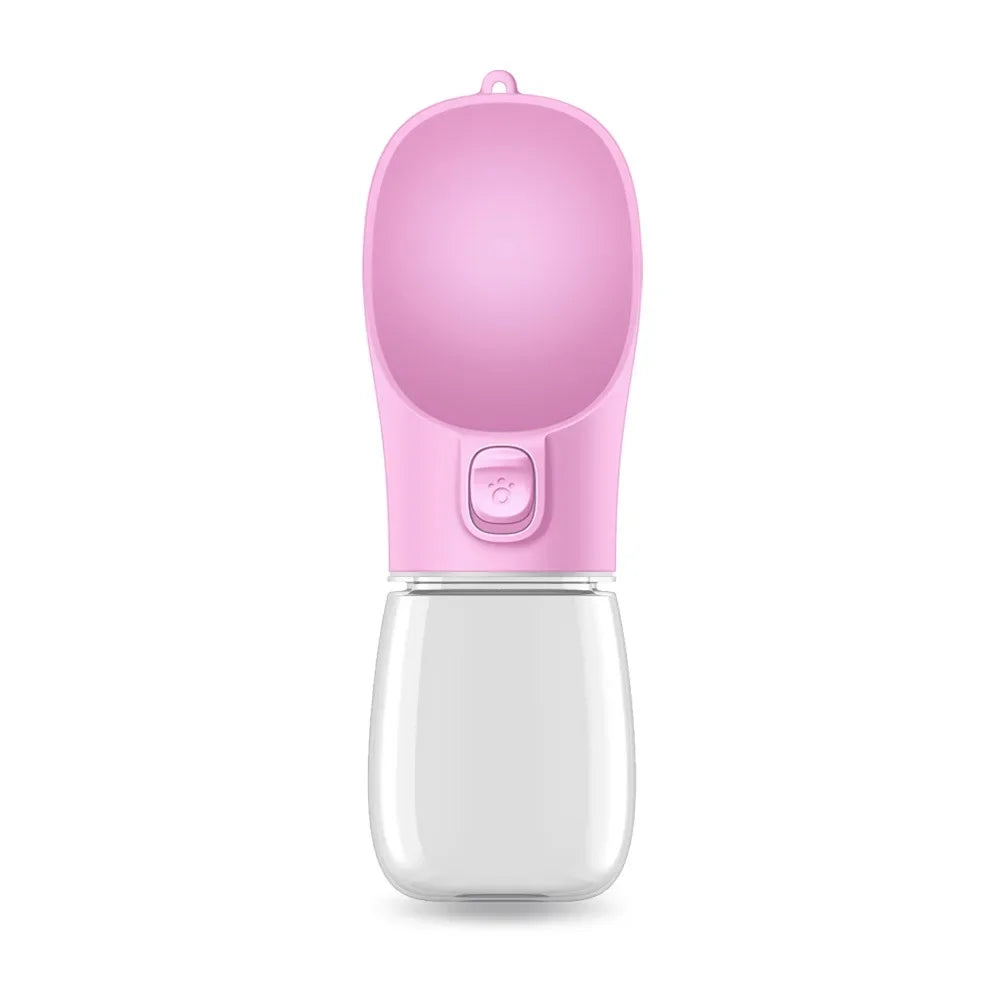 A pink portable pet feeder bottle with a rounded top and a button, designed for easy dispensing of liquids.