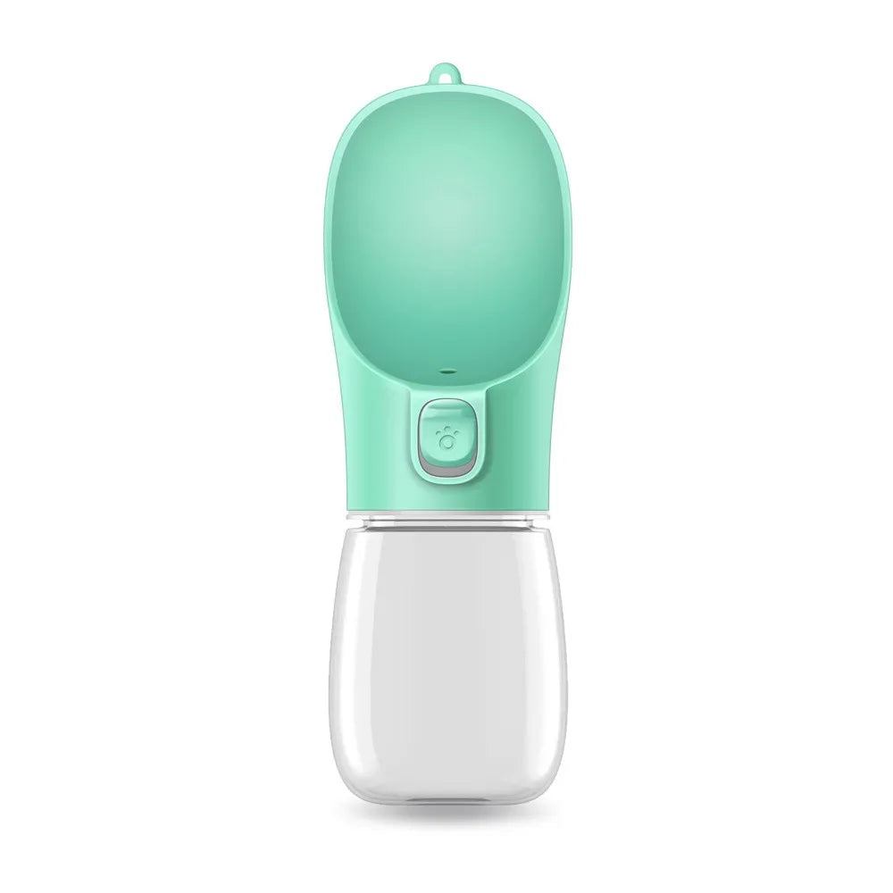 A green portable pet feeder bottle with a rounded top and a button, designed for easy dispensing of liquids.
