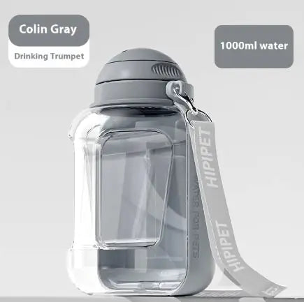 Transparent water bottle labeled "Colin Gray Drinking Trumpet," holding 1000ml, featuring a gray cap and strap.