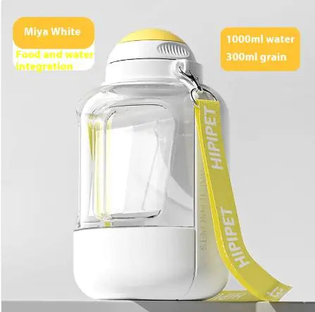 A clear, stylish pet water and food dispenser, featuring a yellow top and strap, holding 1000ml of water and 300ml of grain.