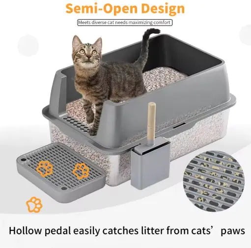 A tabby cat sits in a semi-open litter box designed to trap litter on its paws, featuring a removable cleaning tray and scoop.