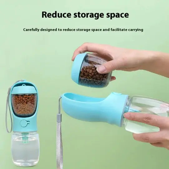 A person holds a compact, blue pet water and food dispenser, featuring a bowl and a container for kibble, designed for easy transport.
