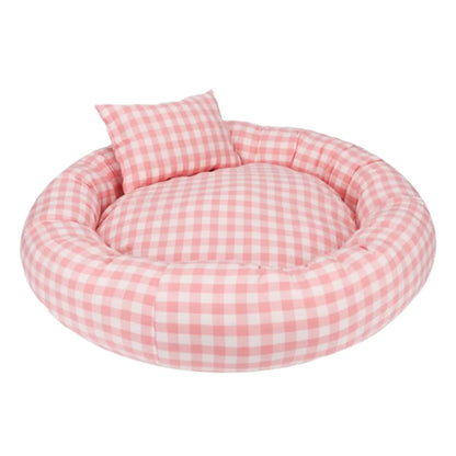 Pink checkered pet bed with a pillow on a white background
