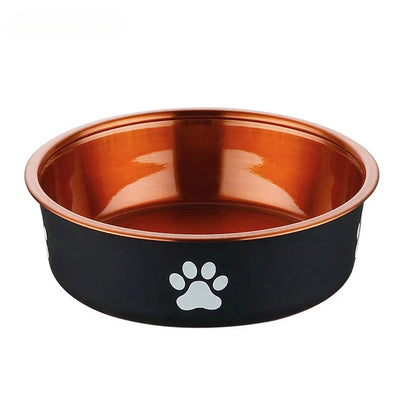 A sleek pet bowl with a black exterior and shiny copper interior, featuring white paw print designs on the side.