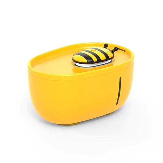 The Aqua Pet Stream Fountain by Shopinapets comes in a yellow, oval-shaped container with a bee-themed lid and antennae, providing pure hydration for your pet with its advanced filtration system.