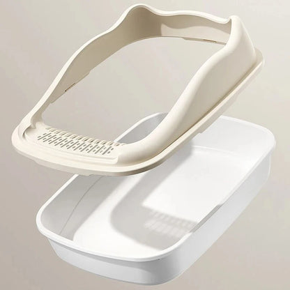 A beige cat litter box lid rests above a white litter tray, designed for pet hygiene and convenience.