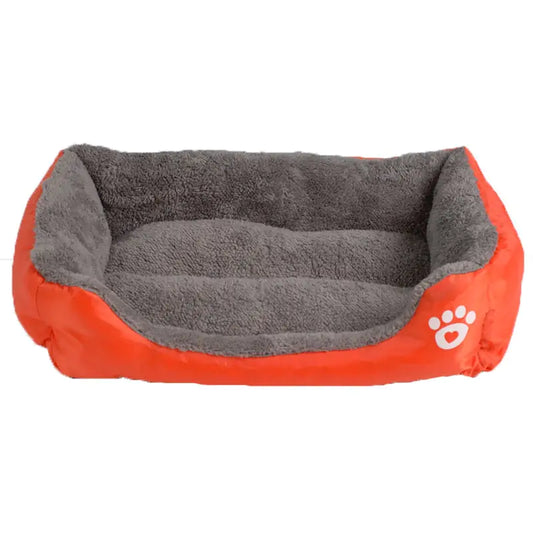 Cozy pet bed featuring a bright orange exterior and soft gray plush interior, designed for comfortable lounging.