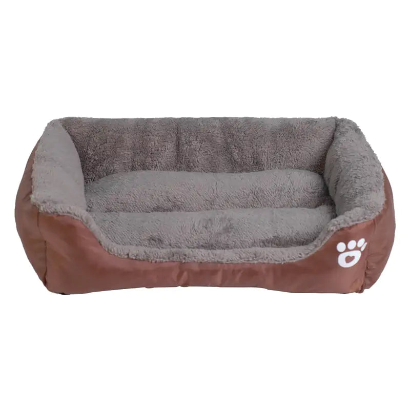 Cozy dog bed with a plush gray interior and brown exterior, featuring a white paw print emblem on the side.