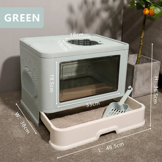 A green cat litter box with a transparent front and scoop, featuring dimensions: W 38cm, L 48.5cm, H 36.5cm, sitting on gray carpet.