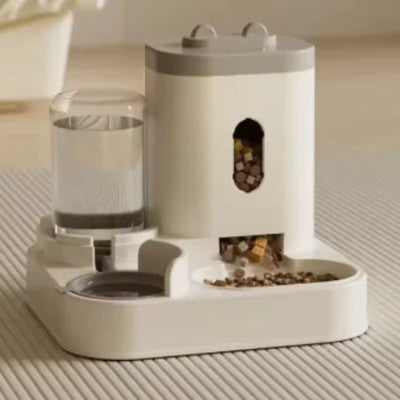 pet feeder with a water dispenser on the left and a food compartment releasing kibble on the right.