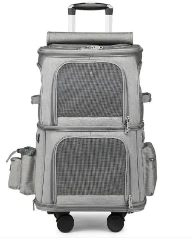 Gray wheeled suitcase with two mesh pockets, a zipper compartment, and an extendable handle, designed for travel convenience.