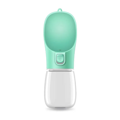 A green portable pet feeder bottle with a rounded top and a button, designed for easy dispensing of liquids.