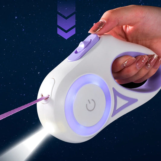 A hand holds a white and purple laser pointer with a flashlight feature, projecting a pink string against a dark background.