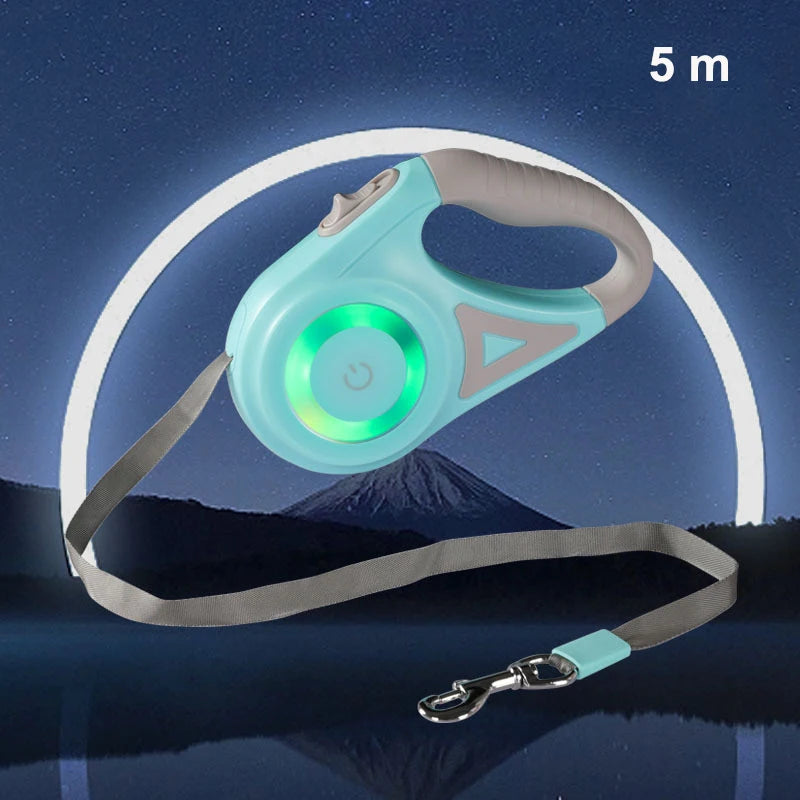 A turquoise retractable dog leash with green LED light, set against a night sky with a mountain silhouette in the background.