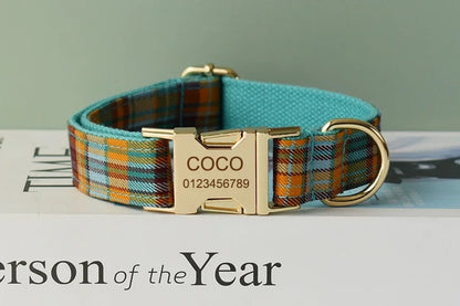 Plaid dog collar with gold buckle and engraved name 'COCO' on a magazine background.