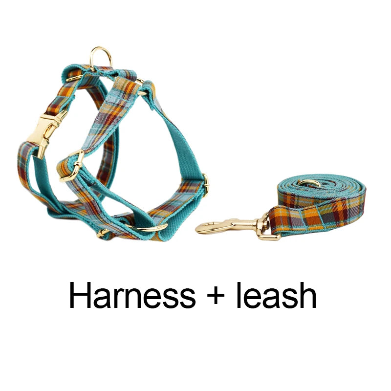 Plaid dog harness and leash set on a white background