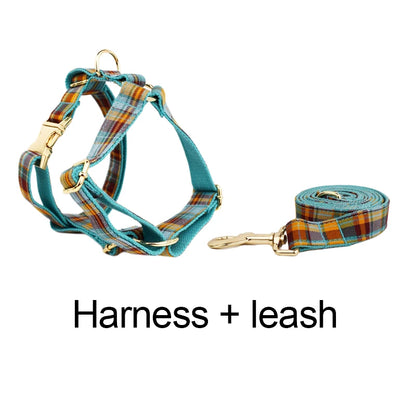 Plaid dog harness and leash set on a white background