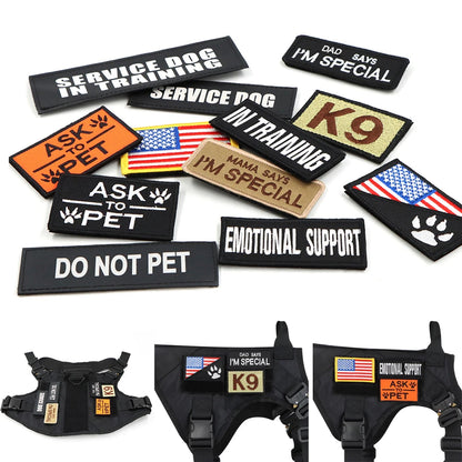 Collection of dog patches and harnesses with various messages on a white background