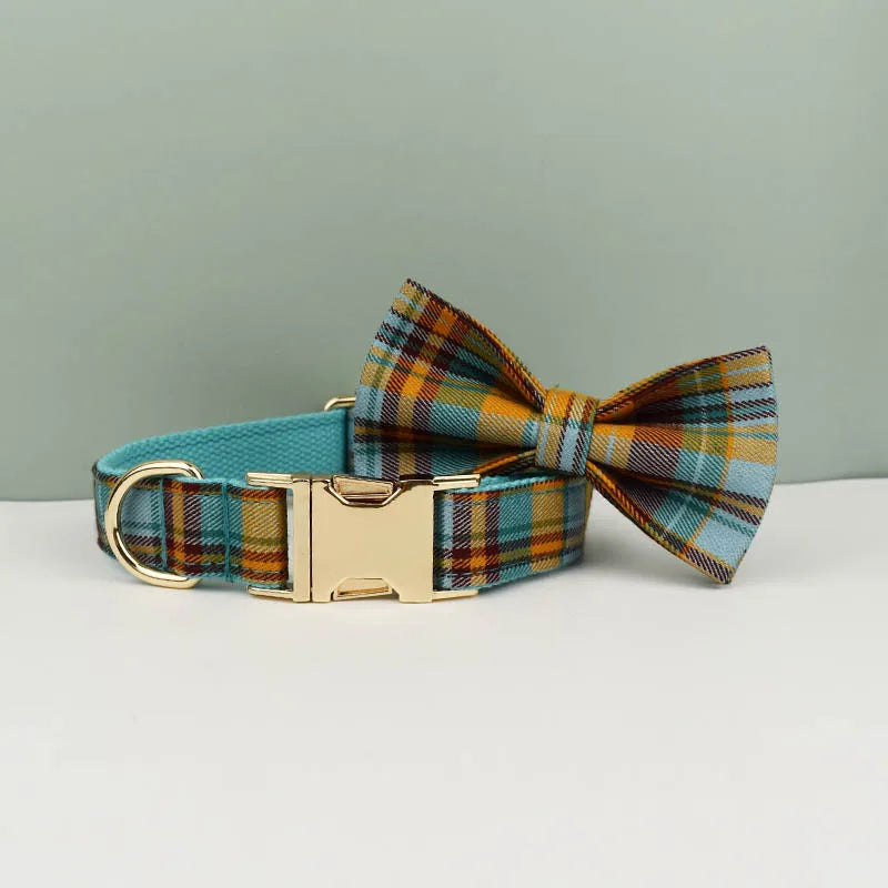 Plaid dog collar and bow tie set on a light gray background