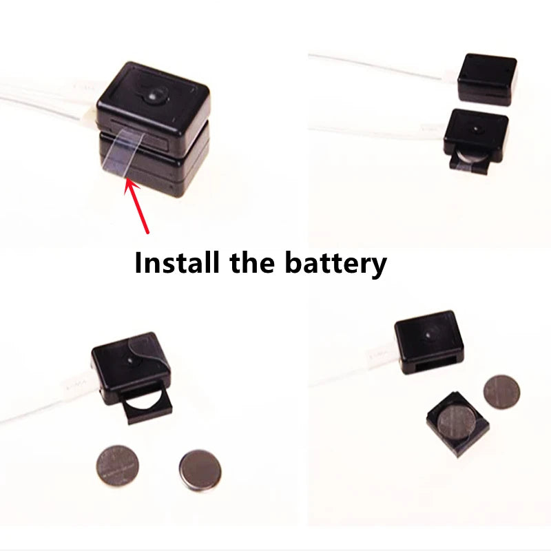 Black square battery-operated device with batteries on a white background