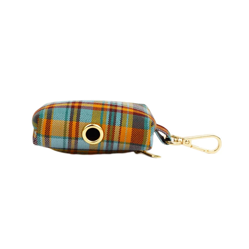 Plaid patterned pouch with a gold zipper and clasp on a white background