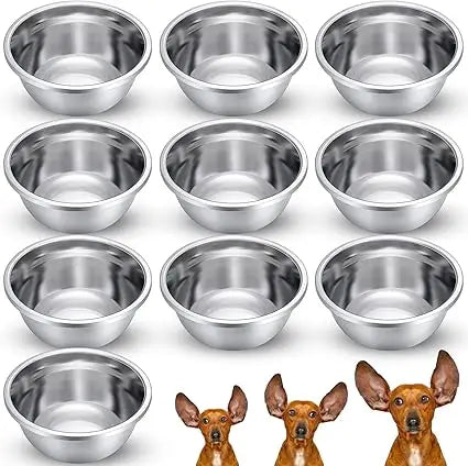 Set of stainless steel bowls with small dog illustrations at the bottom.