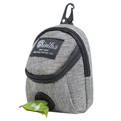 Gray pet waste bag dispenser with a green bag attached on a white background