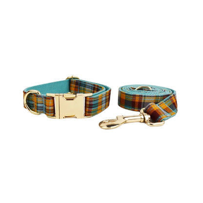 Plaid dog collar and leash set with gold hardware on a white background