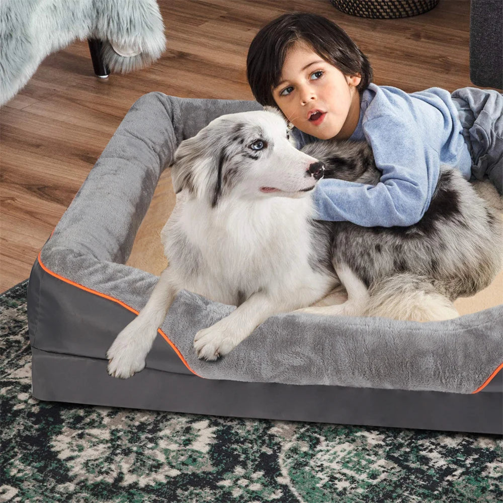 Child and dog on a large gray pet bed in a home setting