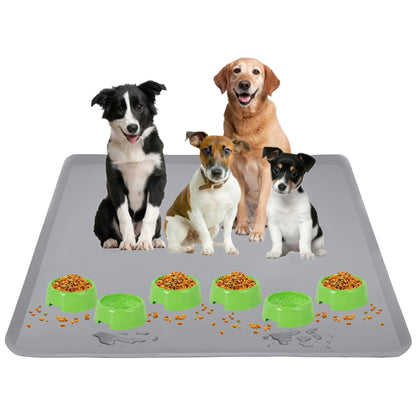 Four dogs around a large gray mat with green bowls containing food on a white background